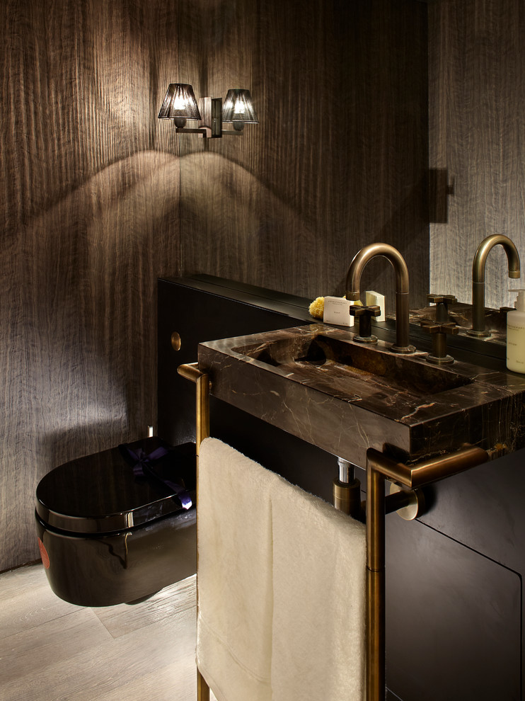 This is an example of a medium sized contemporary bathroom in London with a wall mounted toilet and brown floors.