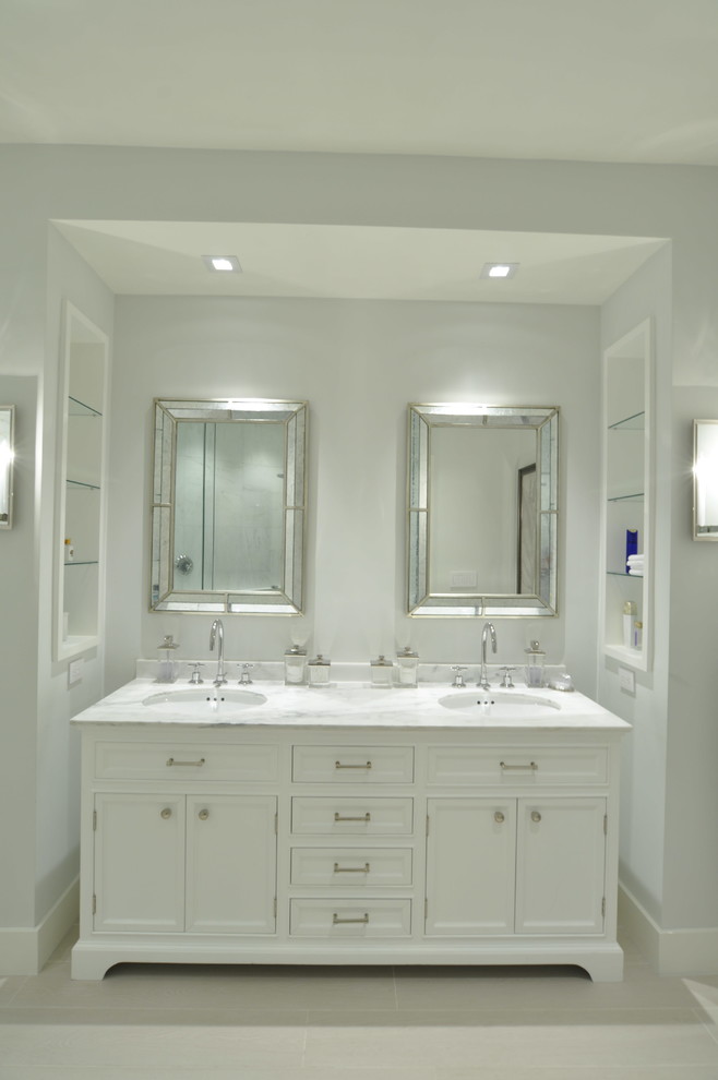 Design ideas for a medium sized classic ensuite bathroom in Miami with flat-panel cabinets, white cabinets, an alcove shower, a one-piece toilet, black and white tiles, stone slabs, white walls, ceramic flooring, a submerged sink and marble worktops.