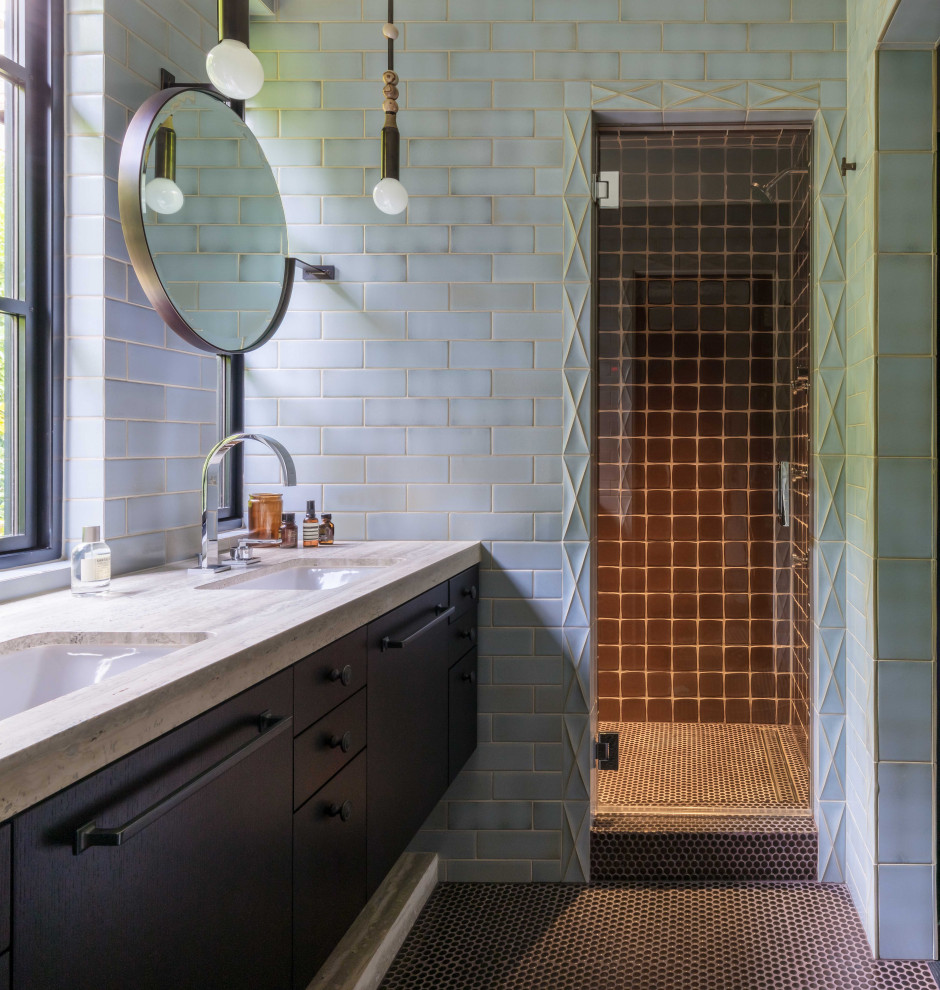Example of a mid-century modern blue tile and subway tile ceramic tile and double-sink alcove shower design in Seattle with dark wood cabinets, a one-piece toilet, an undermount sink, marble countertops, a hinged shower door, beige countertops and a built-in vanity