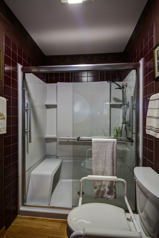 Small classic family bathroom in Other with an integrated sink, raised-panel cabinets, medium wood cabinets, solid surface worktops, an alcove shower, a two-piece toilet, red tiles, ceramic tiles and red walls.