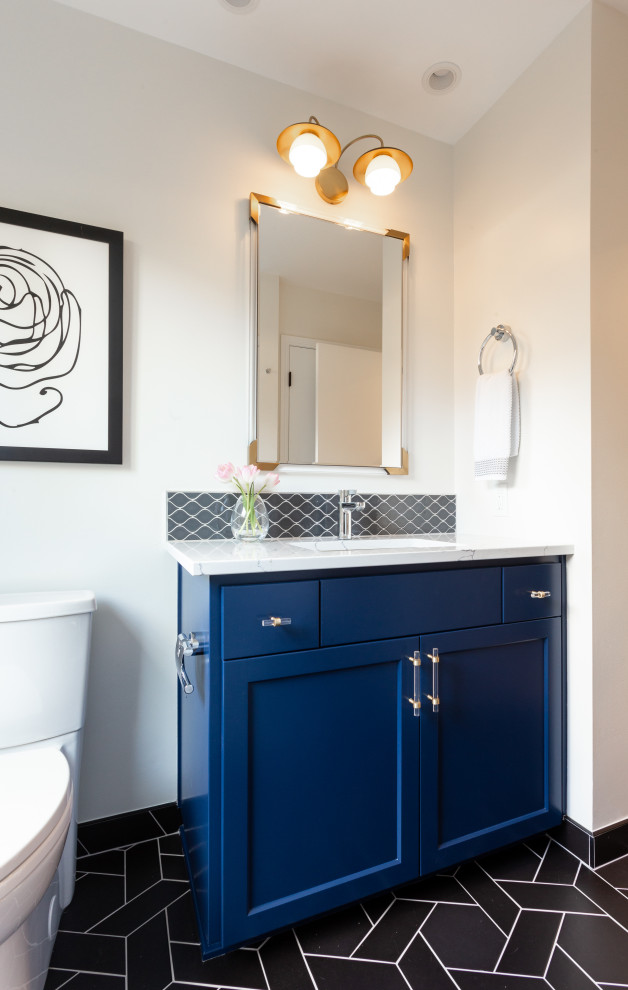This is an example of a contemporary shower room bathroom in Portland with recessed-panel cabinets, blue cabinets, a one-piece toilet, white tiles, white walls, cement flooring, marble worktops, black floors, white worktops, double sinks and a built in vanity unit.