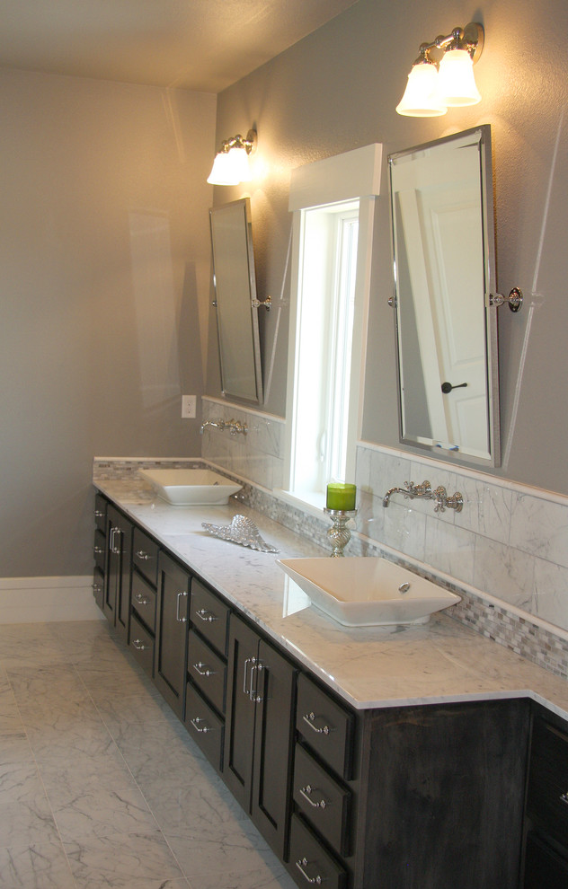Example of a mid-sized mountain style master white tile marble floor double shower design in Dallas with a vessel sink, shaker cabinets, black cabinets, marble countertops, a one-piece toilet and gray walls
