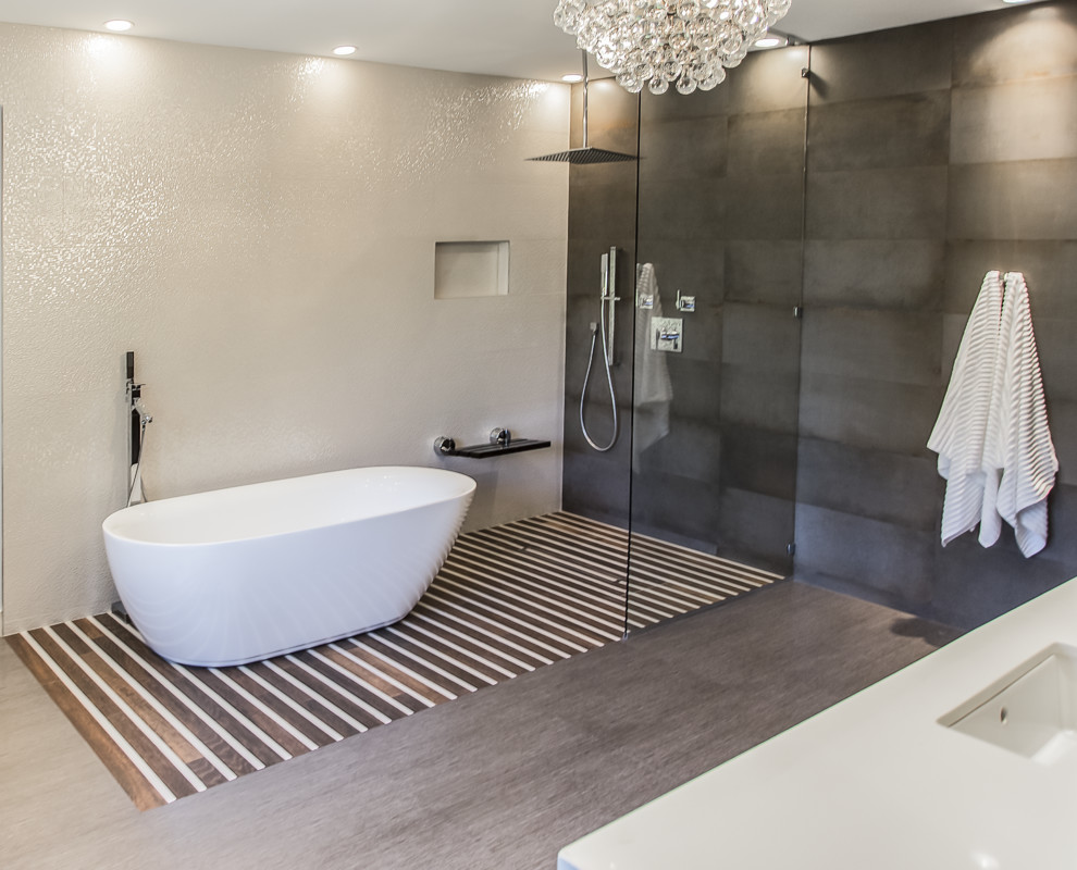 Inspiration for a huge contemporary master gray tile and porcelain tile porcelain tile bathroom remodel in Houston with an undermount sink, furniture-like cabinets, dark wood cabinets, quartzite countertops, a wall-mount toilet and multicolored walls