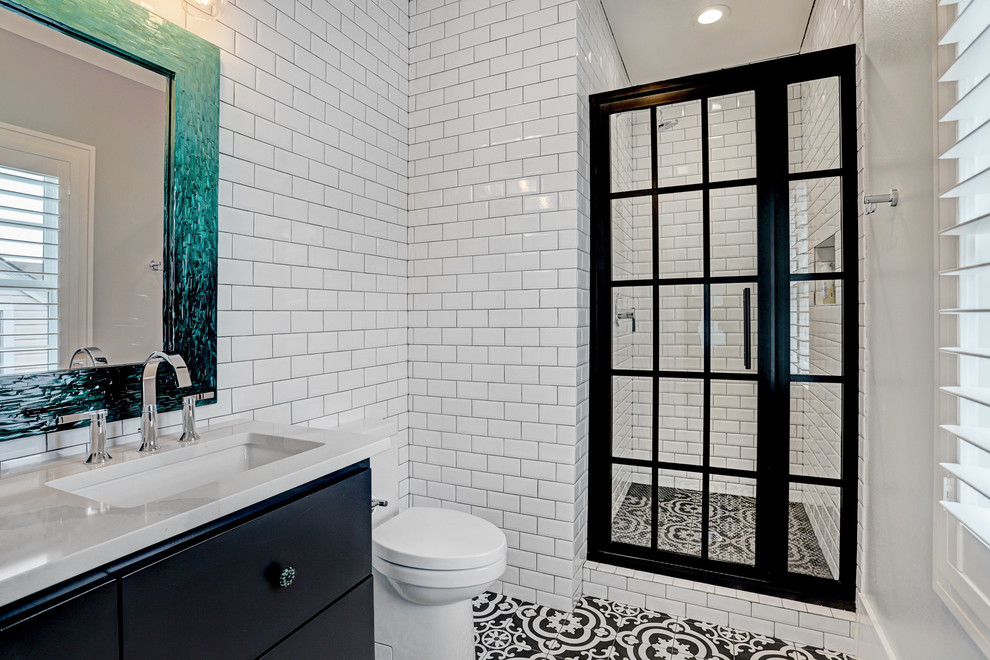 Inspiration for a medium sized classic shower room bathroom in Houston with flat-panel cabinets, blue cabinets, a corner shower, a one-piece toilet, white walls, porcelain flooring, a built-in sink, quartz worktops, multi-coloured floors and white worktops.