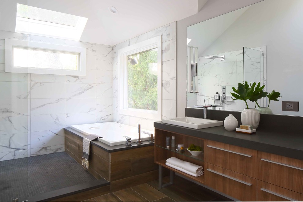 Example of a large minimalist master white tile and porcelain tile porcelain tile bathroom design in New York with flat-panel cabinets, light wood cabinets, a vessel sink and quartz countertops