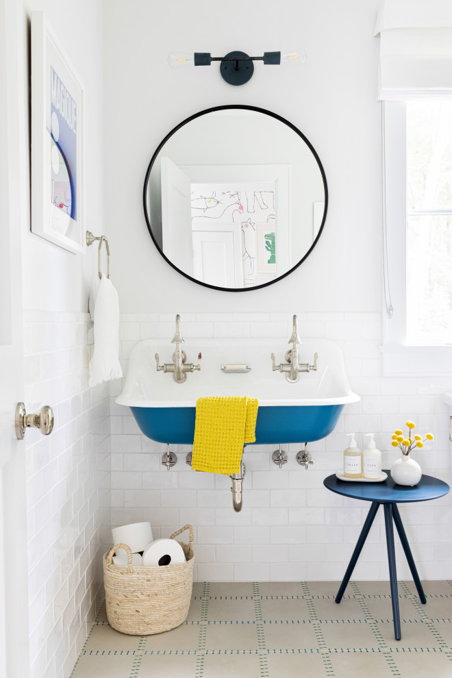 Mid-sized trendy kids' white tile and ceramic tile cement tile floor and beige floor bathroom photo in New York with a one-piece toilet, white walls and a trough sink