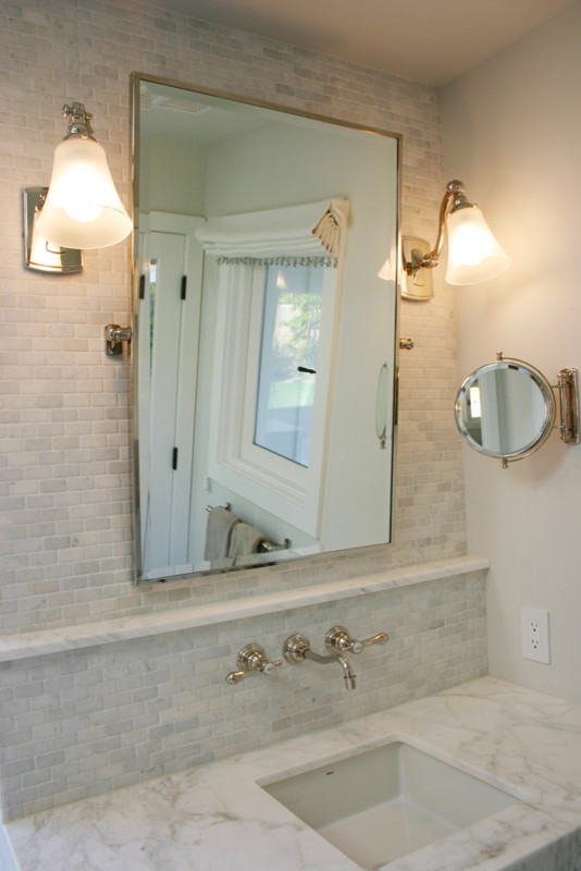 Large classic ensuite bathroom in Orange County with a submerged sink, shaker cabinets, marble worktops, white tiles, white cabinets, a submerged bath, an alcove shower, a one-piece toilet, grey walls and marble flooring.