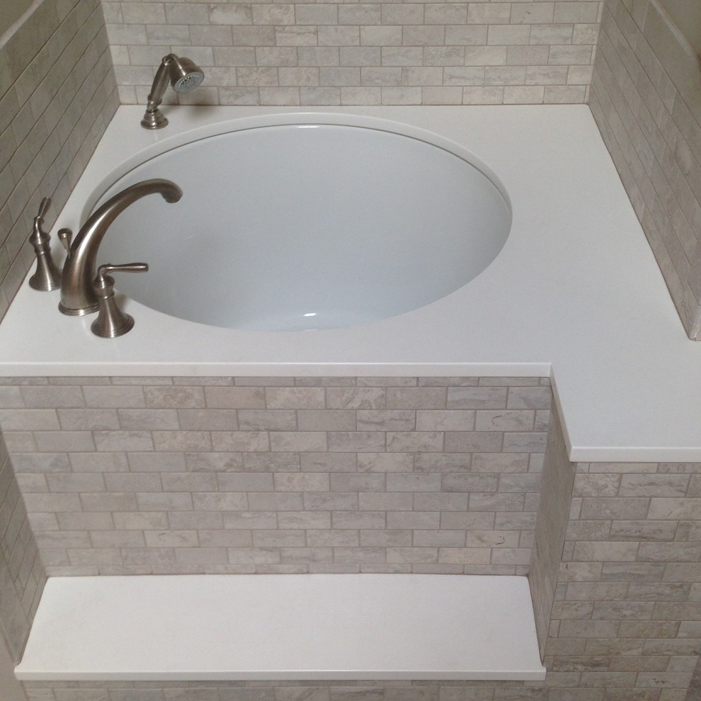 Inspiration for a transitional porcelain tile japanese bathtub remodel in Chicago with quartz countertops