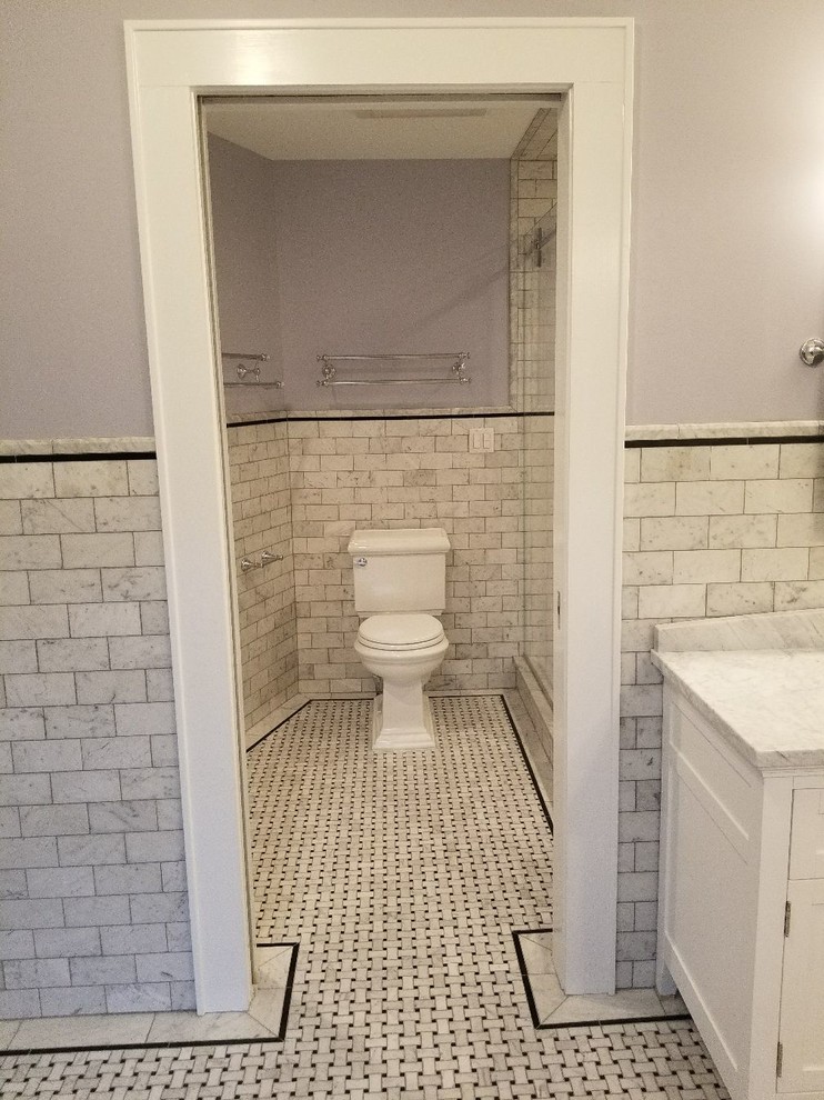 Bathroom - large modern master white tile and marble tile marble floor and white floor bathroom idea in New York with shaker cabinets, white cabinets, a two-piece toilet, purple walls, an undermount sink, marble countertops and white countertops