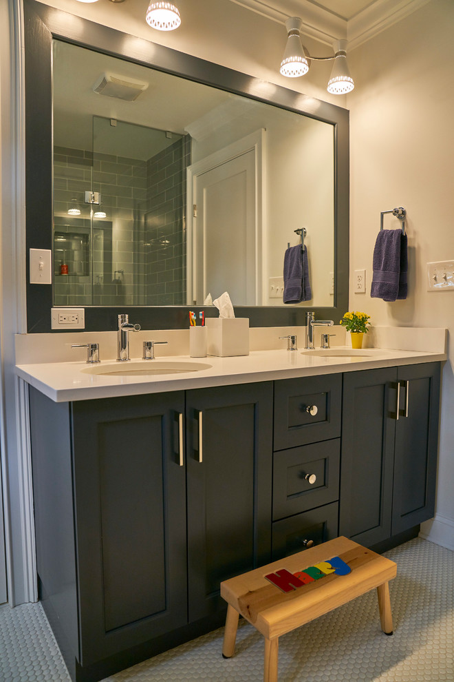 Inspiration for a mid-sized transitional kids' ceramic tile and white floor bathroom remodel in New York with recessed-panel cabinets, black cabinets, gray walls, an undermount sink, quartz countertops and white countertops