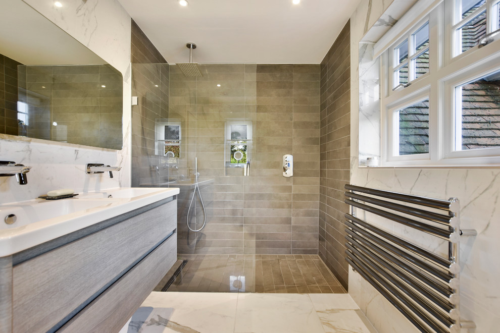 This is an example of a classic bathroom in Surrey with flat-panel cabinets, medium wood cabinets, a built-in shower, beige tiles, brown tiles, an integrated sink, beige floors, an open shower and beige worktops.