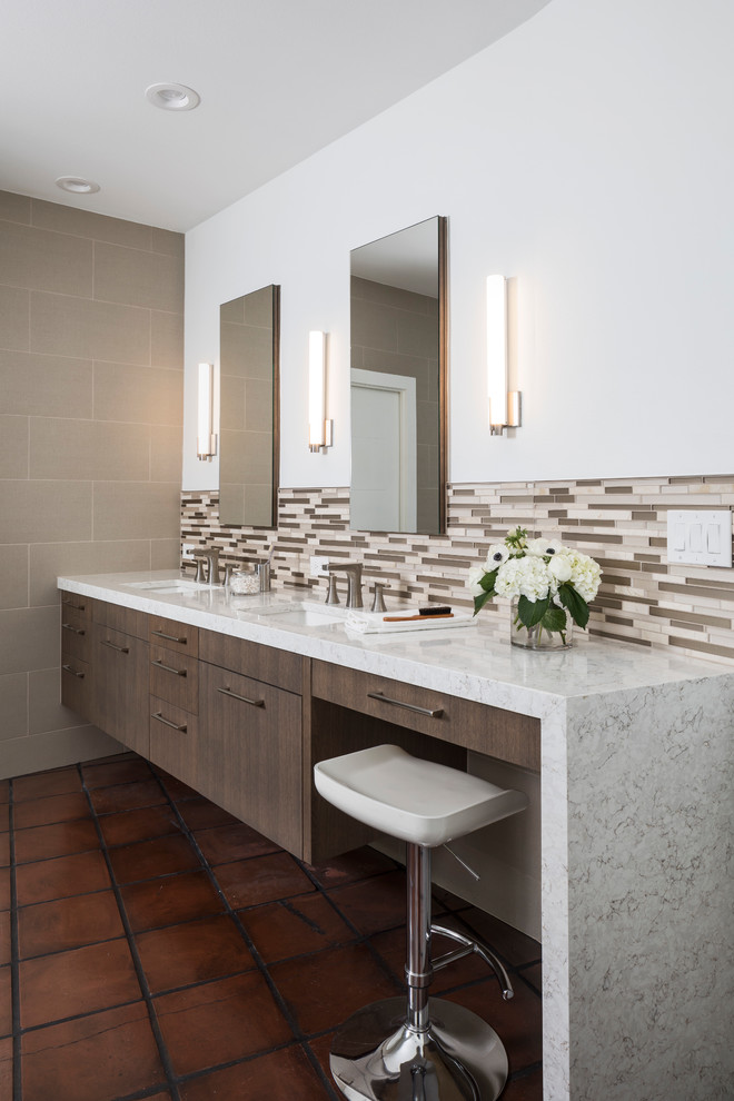 Example of a mid-sized trendy master gray tile and porcelain tile terra-cotta tile and brown floor bathroom design in Austin with flat-panel cabinets, brown cabinets, white walls, an undermount sink and quartzite countertops
