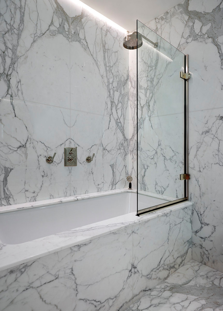 This is an example of a medium sized modern bathroom in London with white walls, a shower/bath combination, grey tiles, white tiles, marble tiles, marble flooring, white floors and an open shower.