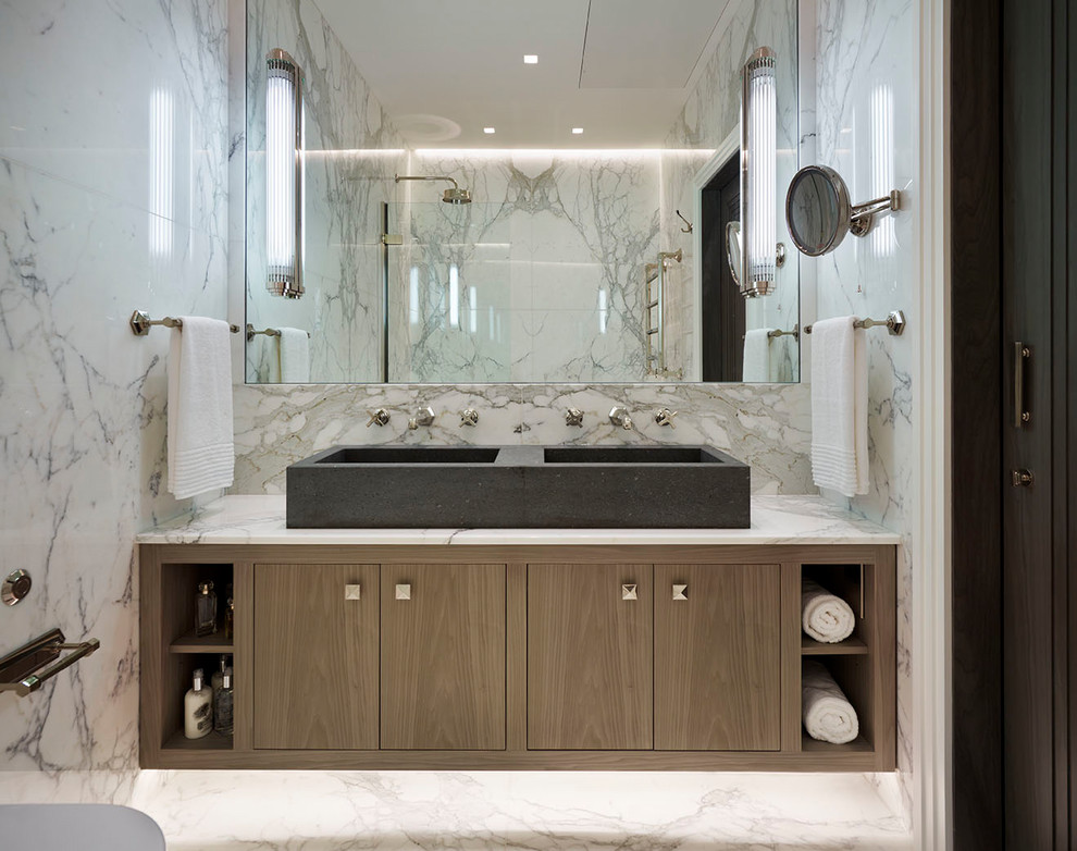 Design ideas for a medium sized modern bathroom in London with flat-panel cabinets, brown cabinets, a shower/bath combination, grey tiles, white tiles, marble tiles, white walls, marble flooring, a vessel sink, white floors and an open shower.