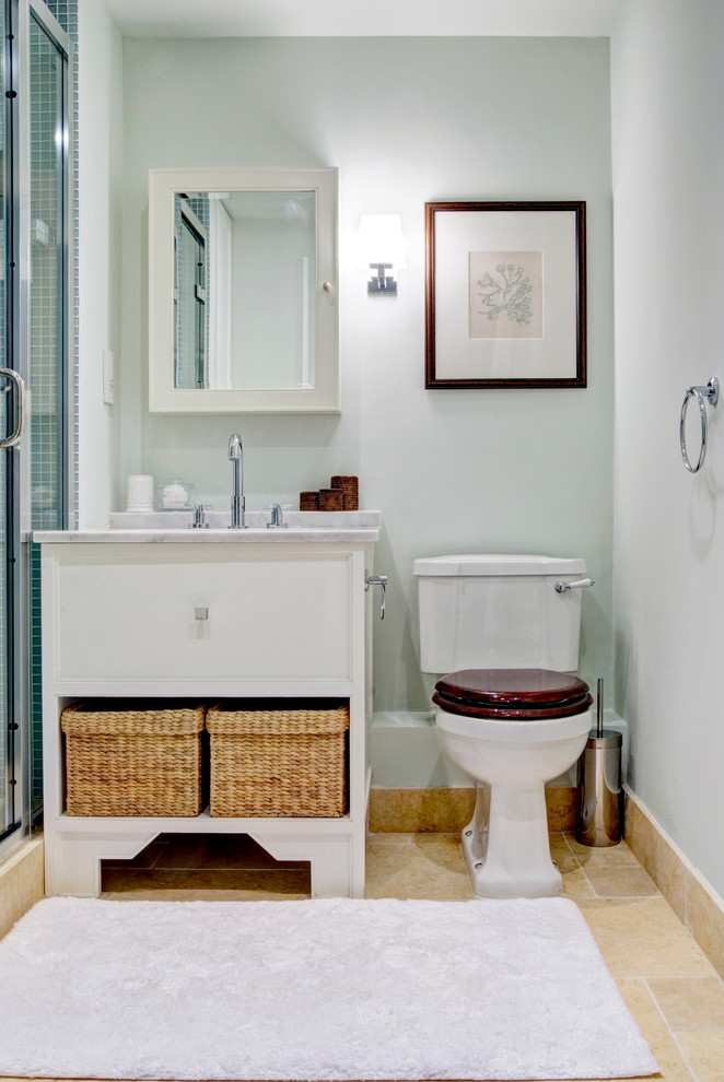 Photo of a traditional shower room bathroom in London with a submerged sink, flat-panel cabinets, white cabinets, a two-piece toilet and grey walls.