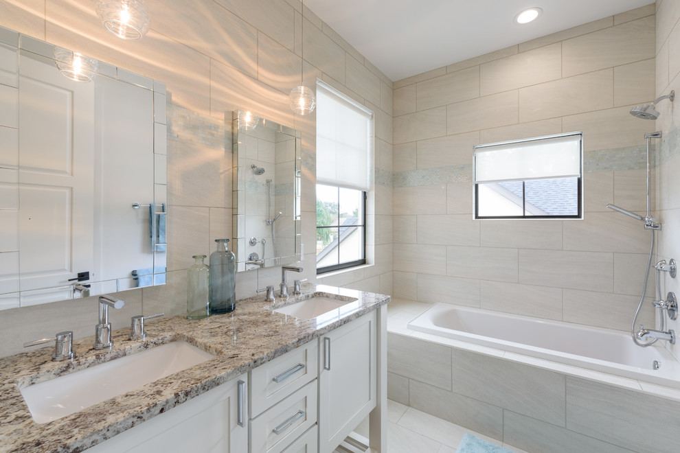 Example of a large kids' beige tile and porcelain tile bathroom design in Orlando with shaker cabinets, white cabinets, a two-piece toilet, an undermount sink and granite countertops