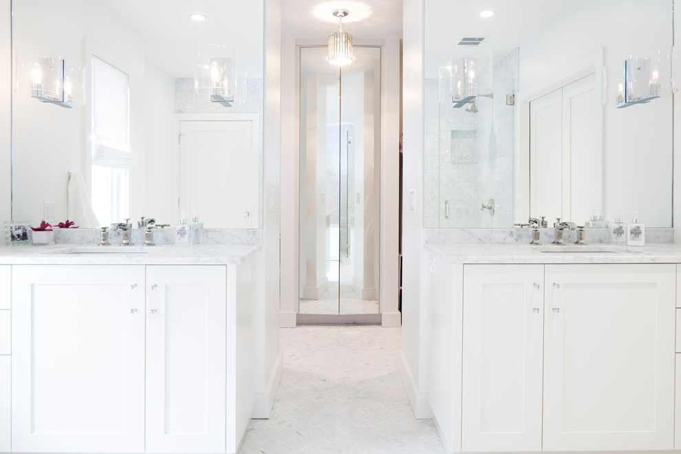 Design ideas for a large traditional ensuite bathroom in Austin with shaker cabinets, white cabinets, a freestanding bath, marble worktops, white walls, marble flooring, a submerged sink and white floors.