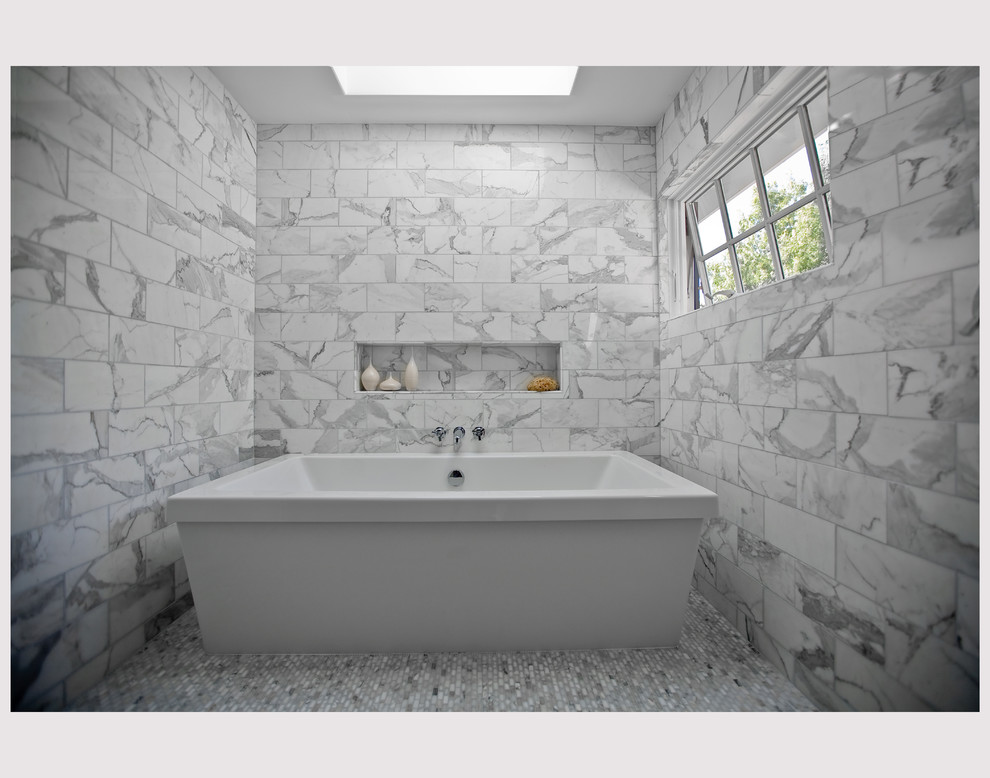 Inspiration for a large timeless master multicolored tile and stone tile marble floor freestanding bathtub remodel in San Francisco with white walls