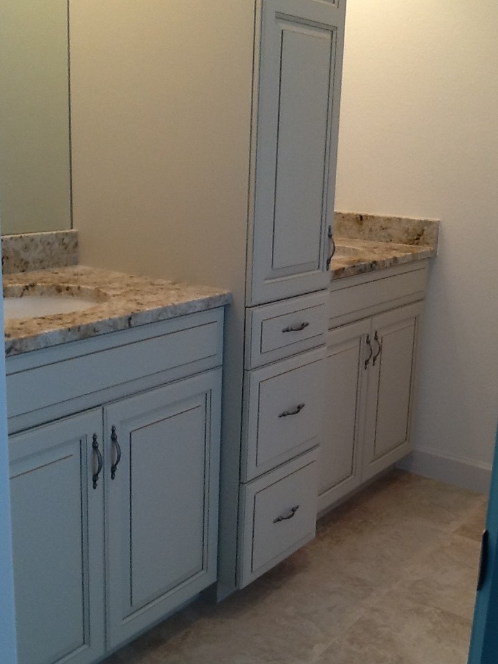 Medium sized classic family bathroom in Phoenix with a vessel sink, raised-panel cabinets, white cabinets, granite worktops, an alcove shower, a two-piece toilet, beige tiles, porcelain tiles, beige walls and porcelain flooring.