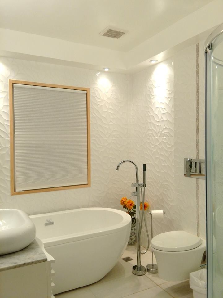 Example of a small minimalist kids' ceramic tile mosaic tile floor and gray floor bathroom design in Los Angeles with white cabinets, a wall-mount toilet and marble countertops