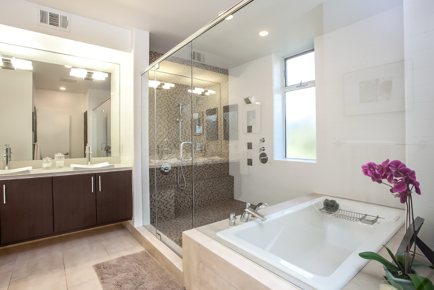 Bathroom - large contemporary master beige floor bathroom idea in Philadelphia with flat-panel cabinets, dark wood cabinets, white walls, a drop-in sink and a hinged shower door