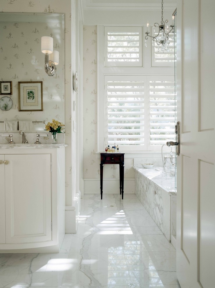 Inspiration for a large timeless master white tile and stone tile marble floor bathroom remodel in Atlanta with beaded inset cabinets, white cabinets, an undermount sink, marble countertops, white walls and white countertops