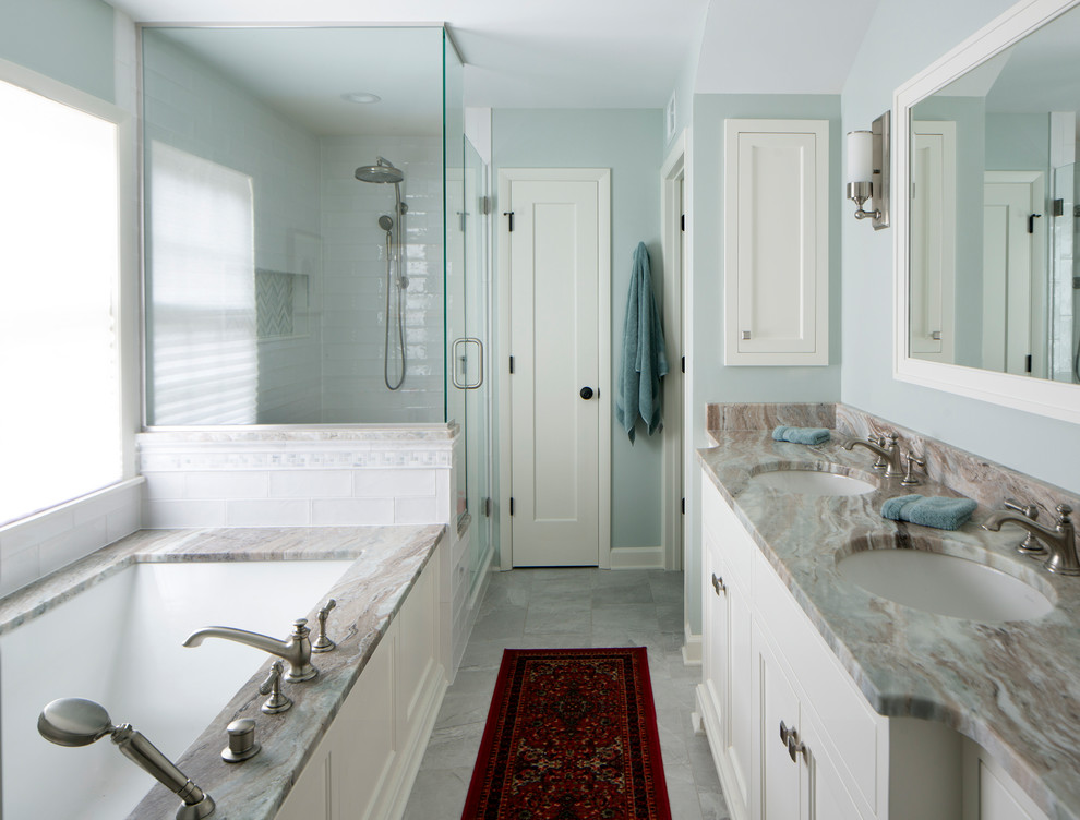Photo of a medium sized traditional ensuite bathroom in Milwaukee with shaker cabinets, white cabinets, a submerged bath, a corner shower, a two-piece toilet, white tiles, ceramic tiles, green walls, marble flooring, a submerged sink, marble worktops, grey floors, a hinged door and brown worktops.
