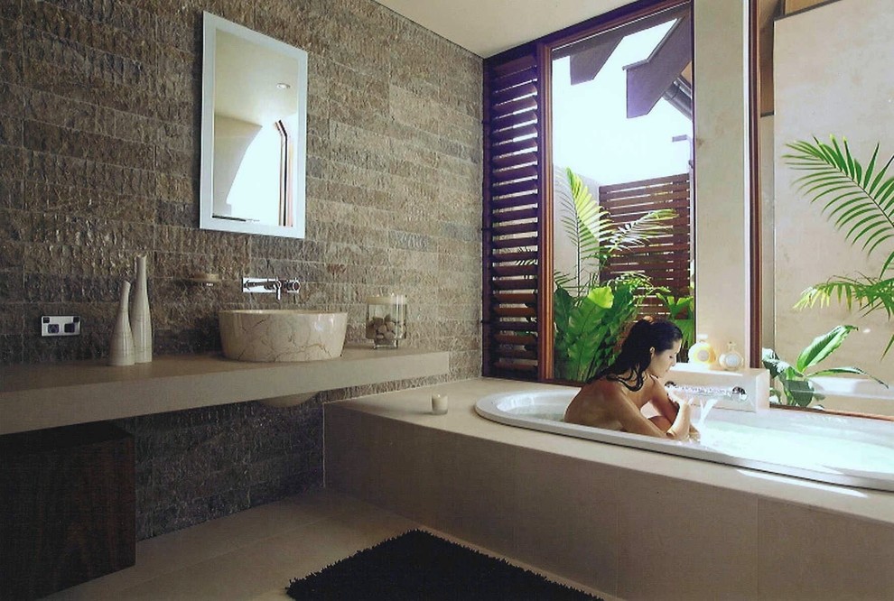 Example of an island style bathroom design in Sydney