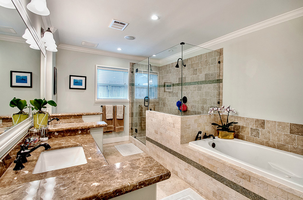 Photo of a medium sized classic ensuite bathroom in Houston with a built-in bath, a corner shower, beige tiles, stone tiles, grey walls, a submerged sink, limestone flooring, beige floors, a hinged door and granite worktops.