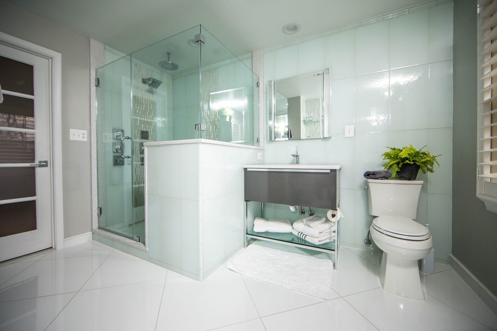 Alcove shower - contemporary master glass tile porcelain tile and white floor alcove shower idea in DC Metro with furniture-like cabinets, dark wood cabinets, a two-piece toilet, gray walls, an undermount sink, quartzite countertops and a hinged shower door