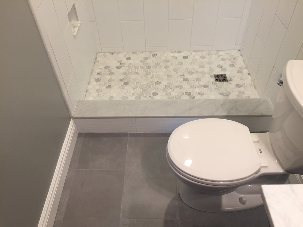 Inspiration for a small modern 3/4 white tile and ceramic tile ceramic tile bathroom remodel in Cleveland with a two-piece toilet, gray walls, an undermount sink and granite countertops