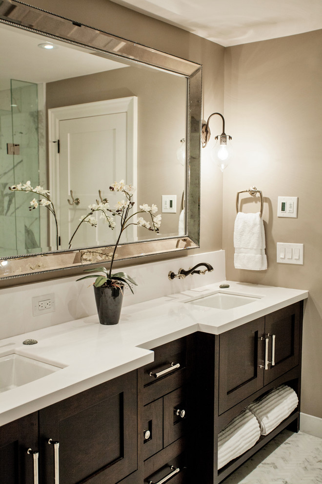 Inspiration for a mid-sized transitional master white tile marble floor bathroom remodel in Toronto with an undermount sink, shaker cabinets, dark wood cabinets, quartz countertops, a one-piece toilet and beige walls