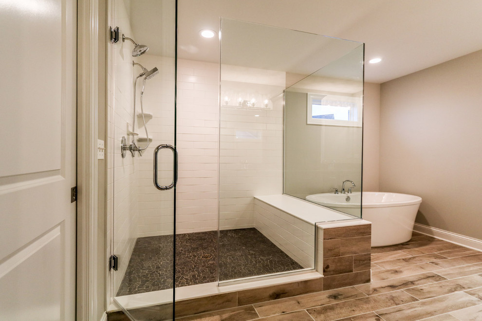 Example of a mid-sized mountain style master white tile and subway tile vinyl floor and brown floor bathroom design in Chicago with beige walls and a hinged shower door