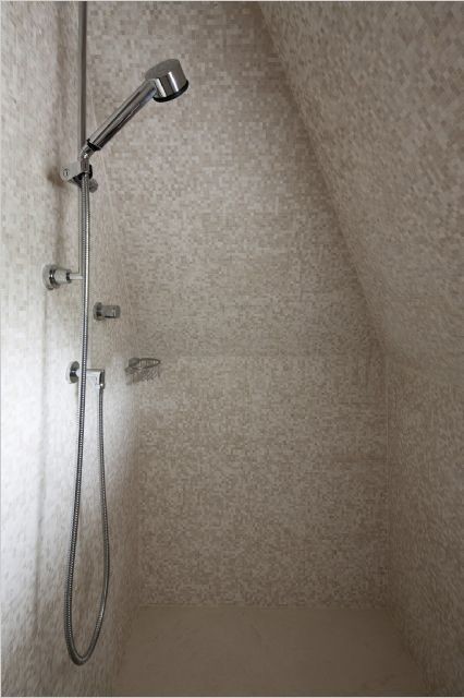 Design ideas for a classic bathroom in New York with a corner shower, white tiles and mosaic tiles.