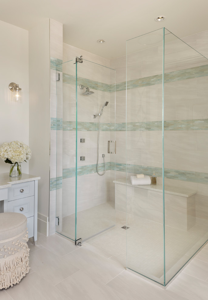 Bathroom - mid-sized tropical master multicolored tile and glass tile porcelain tile and gray floor bathroom idea in Miami with furniture-like cabinets, white cabinets, white walls, an undermount sink, quartz countertops, a hinged shower door and white countertops