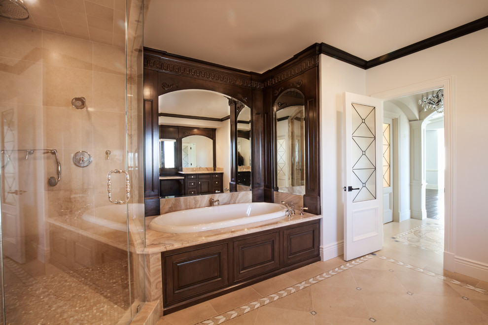This is an example of a medium sized classic ensuite bathroom in Los Angeles with a submerged sink, raised-panel cabinets, dark wood cabinets, a built-in bath, an alcove shower, a two-piece toilet, beige tiles, mosaic tiles, white walls and mosaic tile flooring.