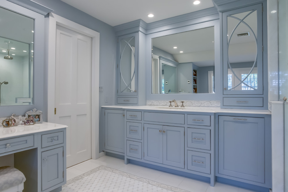 Photo of a medium sized traditional ensuite bathroom in Atlanta with white tiles, metro tiles, a submerged sink, quartz worktops, white worktops, beaded cabinets, blue cabinets, marble flooring and white floors.