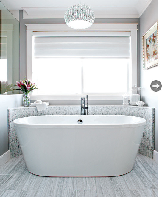 Inspiration for a large classic ensuite bathroom in Vancouver with recessed-panel cabinets, white cabinets, a freestanding bath, a corner shower, a two-piece toilet, grey tiles, stone tiles, grey walls, marble flooring, a submerged sink and engineered stone worktops.