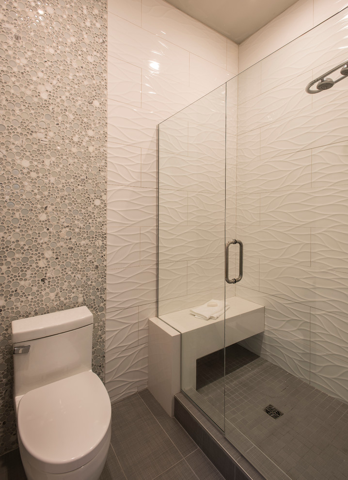 This is an example of a medium sized contemporary family bathroom in Phoenix with flat-panel cabinets, grey cabinets, an alcove shower, a one-piece toilet, white tiles, porcelain tiles, grey walls, porcelain flooring, a submerged sink, engineered stone worktops, grey floors and a hinged door.