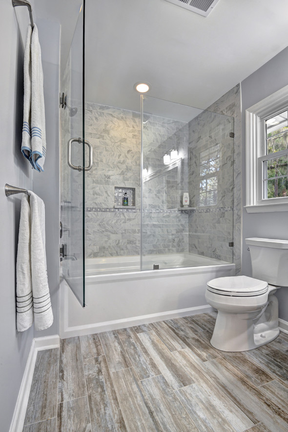 Bathroom - coastal master gray tile and porcelain tile porcelain tile bathroom idea in Charleston with shaker cabinets, white cabinets, a two-piece toilet, gray walls, an undermount sink and marble countertops