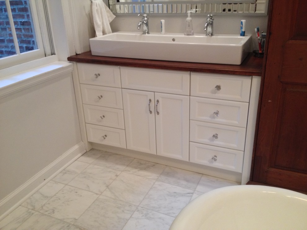 Inspiration for a classic bathroom in Philadelphia with flat-panel cabinets, light wood cabinets and granite worktops.