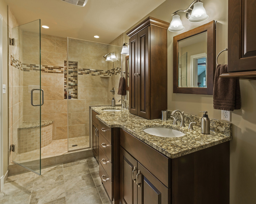 Alcove shower - mid-sized transitional master beige tile and ceramic tile ceramic tile alcove shower idea in Milwaukee with an undermount sink, raised-panel cabinets, dark wood cabinets, granite countertops, a two-piece toilet and beige walls