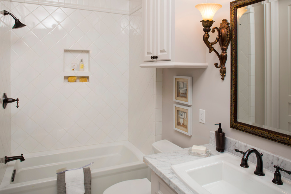 Huge elegant single-sink bathroom photo in Houston with raised-panel cabinets, white cabinets, an undermount sink, gray countertops and a built-in vanity