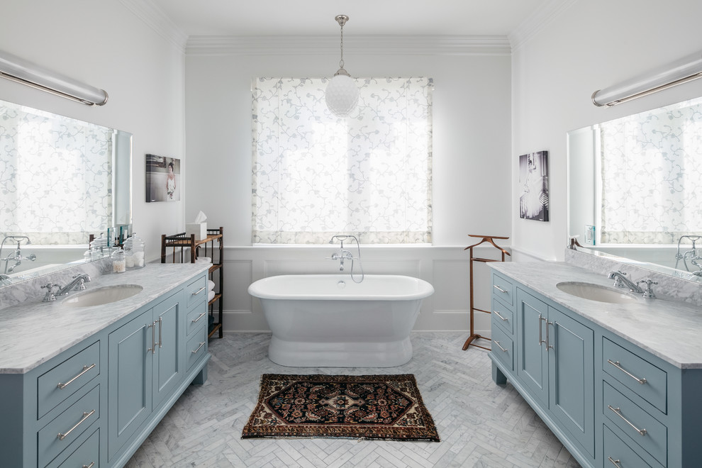 Example of a huge trendy master marble floor, gray floor and double-sink freestanding bathtub design in Houston with white walls, an undermount sink, gray countertops, flat-panel cabinets, gray cabinets, quartz countertops and a built-in vanity