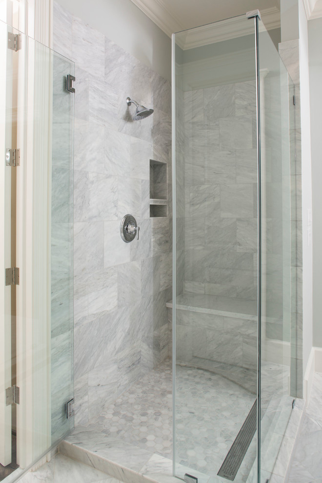 Huge transitional master marble floor and double-sink claw-foot bathtub photo in Houston with recessed-panel cabinets, gray cabinets, marble countertops, a hinged shower door, white countertops and a built-in vanity