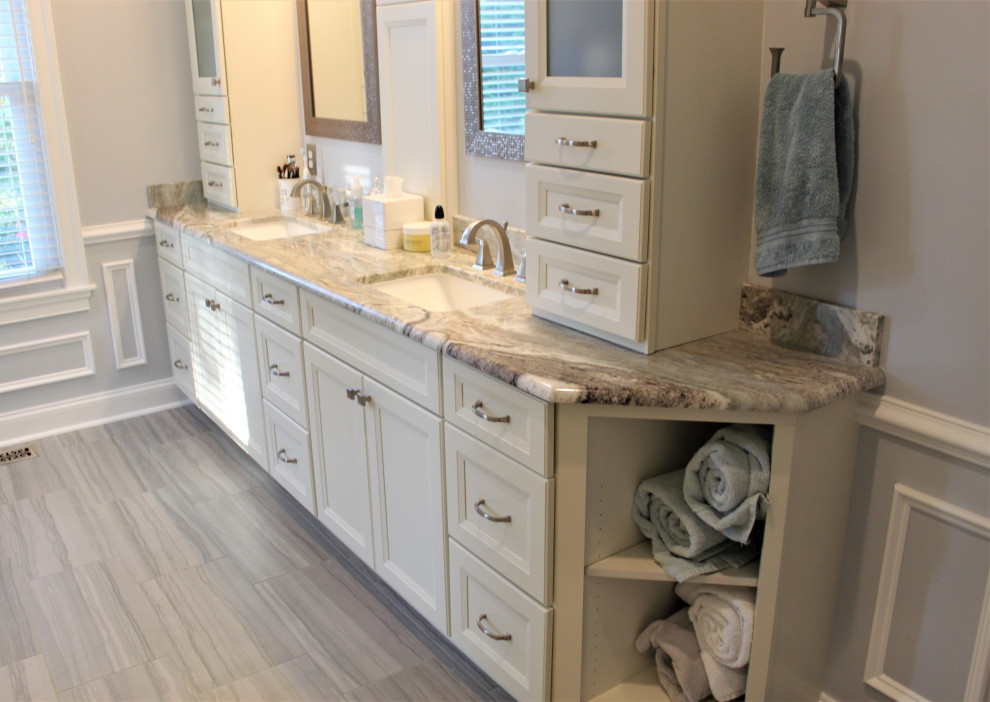 This is an example of a large traditional ensuite bathroom in DC Metro with white cabinets, a double shower, ceramic flooring, a submerged sink, granite worktops, a hinged door, a shower bench and double sinks.