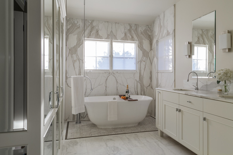 Photo of a large classic ensuite bathroom in San Francisco with shaker cabinets, white cabinets, a freestanding bath, an alcove shower, multi-coloured tiles, marble tiles, multi-coloured walls, marble flooring, a submerged sink, marble worktops, multi-coloured floors and a sliding door.