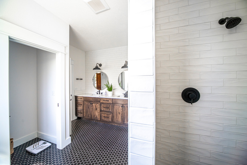 Large transitional master white tile and subway tile cement tile floor and black floor corner shower photo in Portland with shaker cabinets, distressed cabinets, white walls, an undermount sink, marble countertops and white countertops
