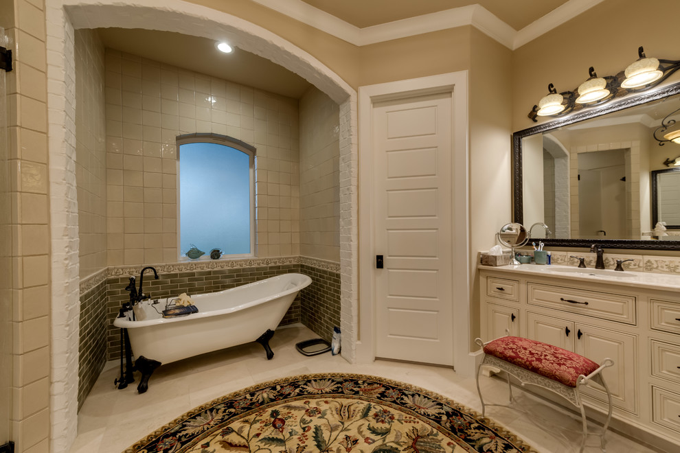 Inspiration for a mid-sized timeless master beige tile and subway tile slate floor and white floor bathroom remodel in Dallas with furniture-like cabinets, dark wood cabinets, a one-piece toilet, beige walls, an undermount sink, quartzite countertops and a hinged shower door