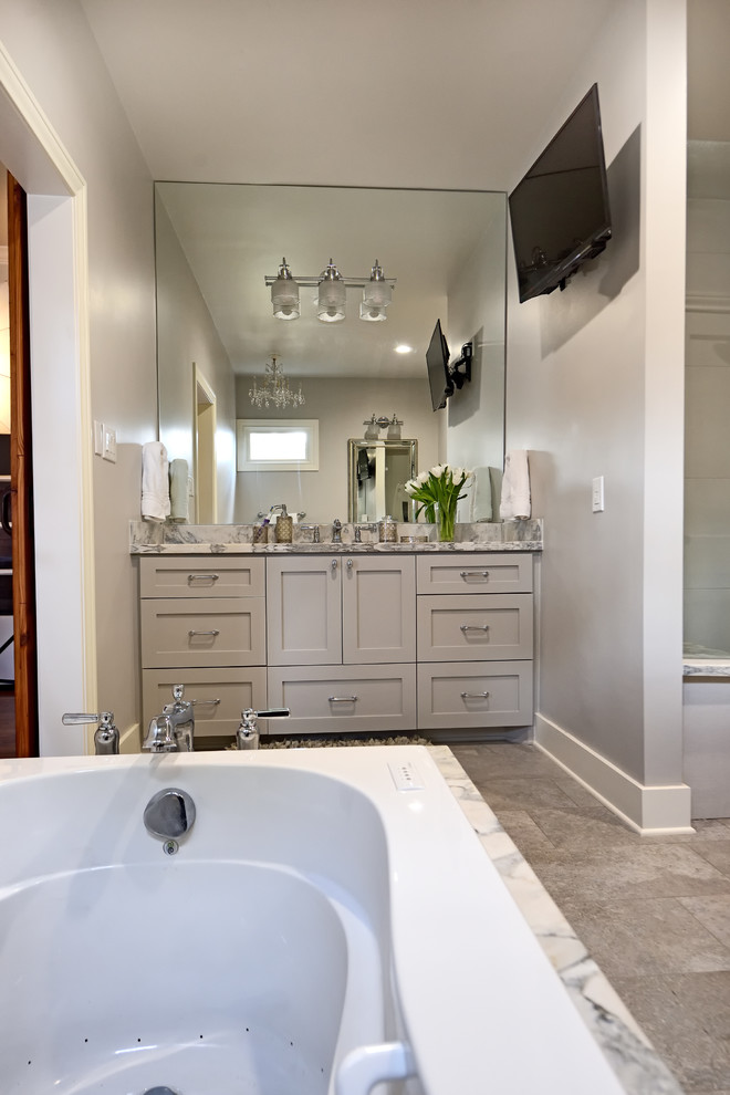 Medium sized rustic ensuite bathroom in Houston with shaker cabinets, white cabinets, a shower/bath combination, a one-piece toilet, white tiles, grey walls, marble flooring, a submerged sink, quartz worktops, grey floors, a shower curtain and grey worktops.